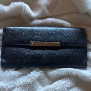 Gucci Black Embossed GG Leather Continental Wallet. Comes with COA